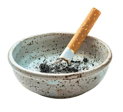 A half-smoked cigarette rests in a ceramic ashtray filled with ash. isolate on white background