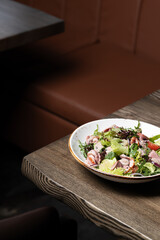 Duck Salad on Wooden Table
