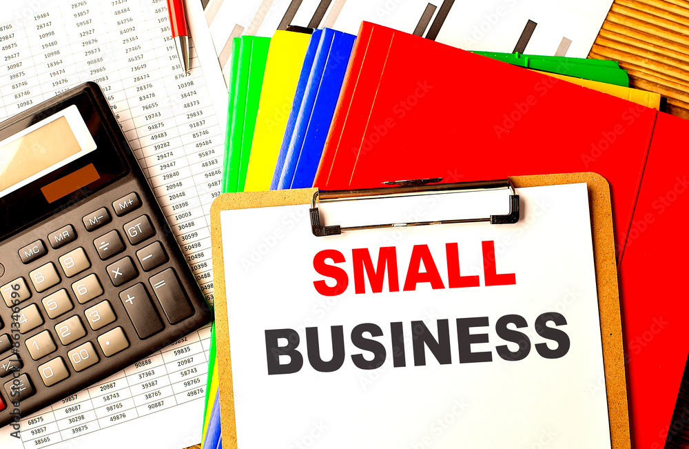 Poster small business text on clipboard with calculator and color folder