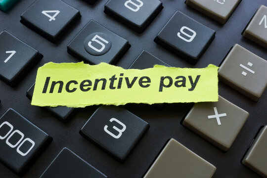 Incentive pay word on the piece of paper.