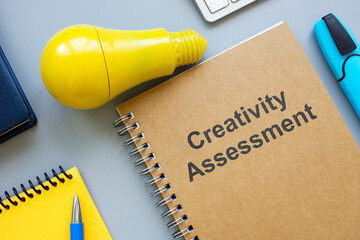 Creativity assessment report and yellow bulb.