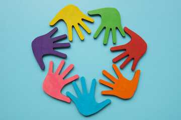 Circle of colored palms. Ethnic diversity and equal rights.
