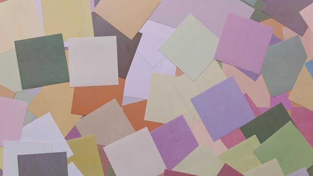 Colorful logo paper randomly placed horizontally background. Abstract geometric background.