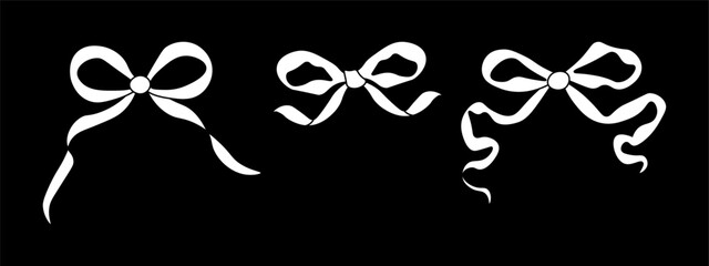 Set of bows on black background. Bowknots for hair decor. Trendy girls hair braiding accessories