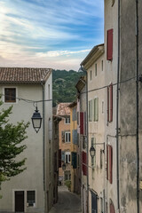 Anduze in France, old facades in the historic center, typical street
