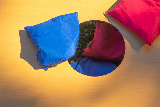 Corn hole selective focus copy space background image fun outdoor games, natural authentic light, playing a game