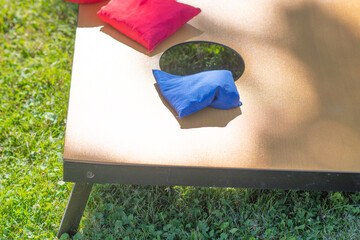 Corn hole selective focus copy space background image fun outdoor games, natural authentic light, playing a game