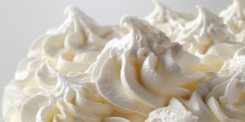 Close Up of Whipped Cream Topping with Swirled Peaks in Soft White Light