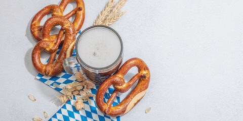 Traditional Oktoberfest set. Pretzels and beer, German festival food concept. Trendy hard light