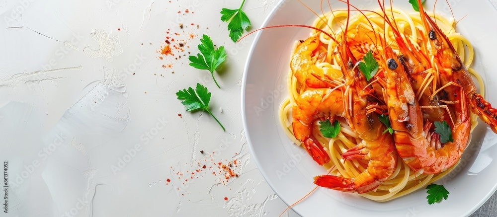 Poster top view of appetizing spaghetti pasta and large shrimp garnished with parsley on a plate against a 