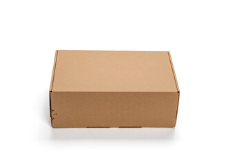 A cardboard box is sitting on a white background. The box is empty and has no writing on it