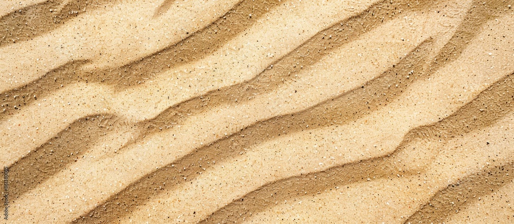 Aufkleber Close-up view of natural beach sand texture with wavy ground, creating a background, seen from the top with copy space image.