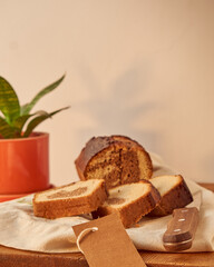 A marbled pudding on a board with a label for branding