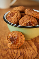 A bowl with pepas cookies on a table