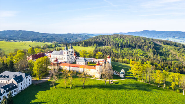 Hora Matky Bozi Monastery in Dolni Hedec, Czechia. The monastery is nestled on a hilltop overlooking the town and countryside. The photo showcases the unique architecture and the scenic landscape.