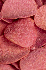 adding red dye to potato chips