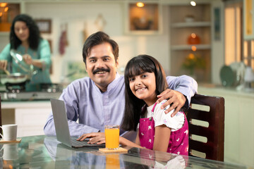 Handsome Dad And Daughter Smiling While Looking At Camera
