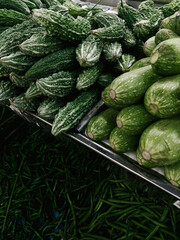 vegetables and fruits on the counter of an Asian store