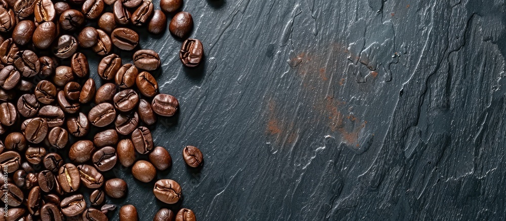 Aufkleber Close-up image of coffee beans on a black mirror background with copy space image.