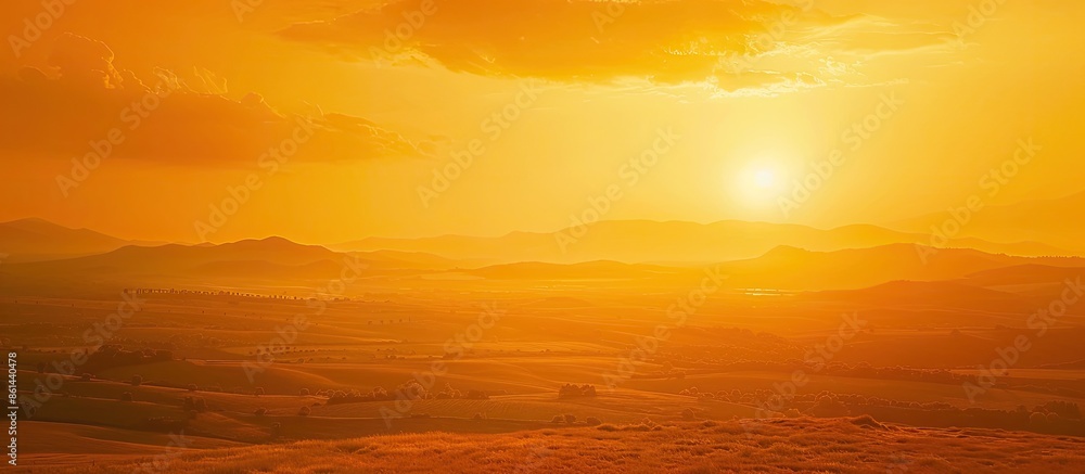 Poster Capture the stunning sunset with a fiery orange sky, offering a picturesque view with plenty of empty space for text or images. image with copy space