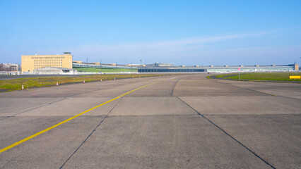 Clear blue skies over the historic Berlin Tempelhof Airport in Germany, showcasing the vast airport...