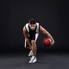 Basketball, exercise and man dribble in studio for training, workout and healthy body fitness...