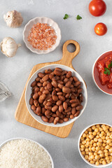 Boiled brown kidney beans on plate and cook ingredients