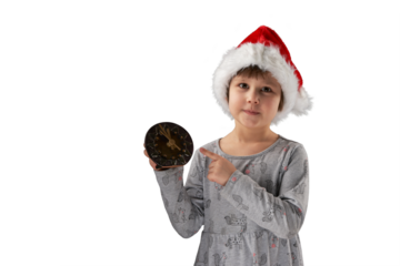 Christmas night. A cute child in a Santa Claus hat holds a clock and reminds that there are 5 minutes left till midnight. Png.