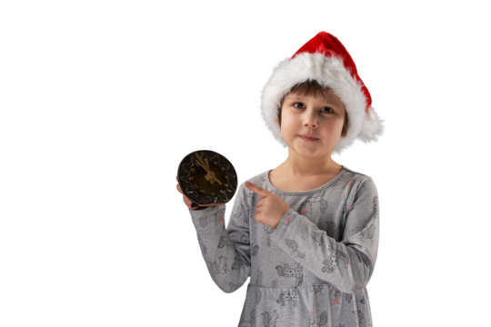 Christmas night. A cute child in a Santa Claus hat holds a clock and reminds that there are 5 minutes left till midnight. Png.