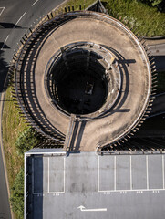 Aerial view of a carpark, with spiral multi-storey entrance
