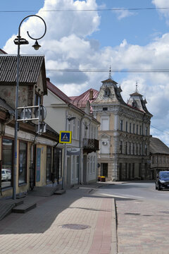 Centre of the popular picturesque town of Tukums looking along Liela iela street, with traditional buildings and old style curly lampost. Tukums, Latvia 06 04 2024 C