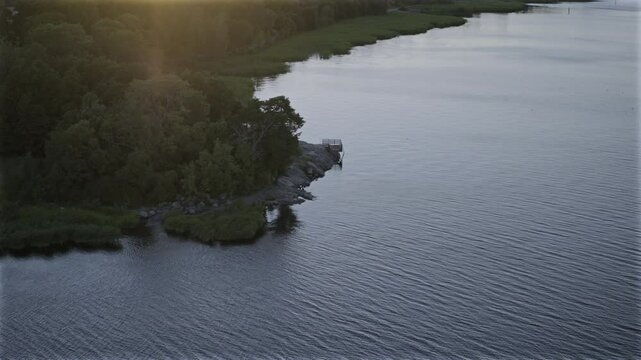 Aerial view of swimming spot at edge of forest in Scandinavia