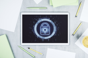 Top view of modern digital tablet monitor with creative lock hologram and chip. Information security concept. 3D Rendering