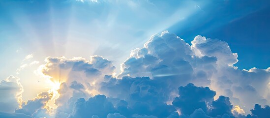 A scenic sunrise morning with a lovely blue sky, fluffy white clouds, and a natural background in the copy space image.