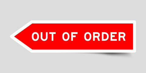 Red color arrow shape sticker label with word out of order on gray background
