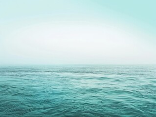 Obraz premium An endless expanse of blue unfolds above and below, sunlit waves dance on the horizon in a breathtaking summer seascape