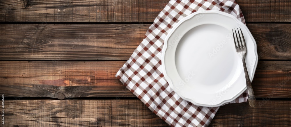 Poster a white plate and fork are displayed on a vintage wooden table with a checkered tablecloth, offering