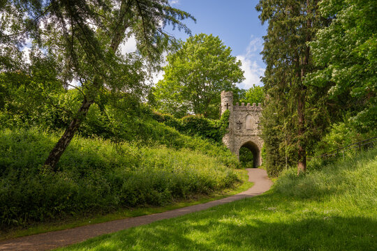 Castle Grounds, a public park in Reigate, Surrey, UK. While the castle no longer exists, a mock medieval gateway was built over the ruins in 1777.