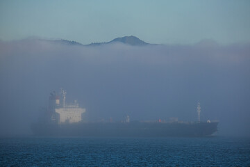 World famous red steel suspension bridge in San Francisco port entrance with Golden Gate State park...