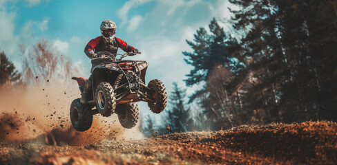 Man jumps atv through forest on sunny day