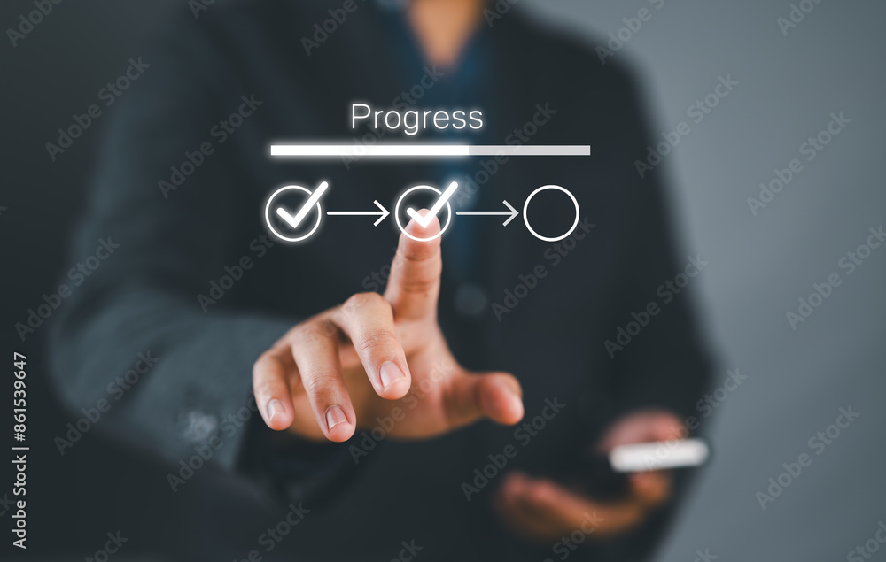 Fototapete Businessman touching to tick correct mark in checklist with progressive loading status to remind work task progressive for project develop management and tracking concept.