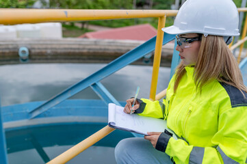 Environmental engineers work at wastewater treatment plants,Water supply engineering working at Water recycling plant for reuse