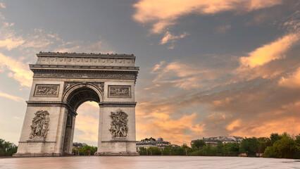 Famous Arc de Triomphe against nice blue sky Arc de Triomphe monument at at the western end of the Champs-elysees road in Paris, France