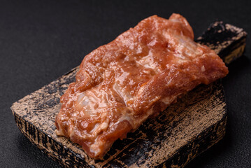 Raw pork or beef ribs in honey sauce with salt, spices