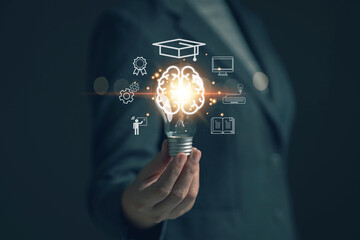 Glowing light bulb in hand, idea search concept Creativity from information trade in the internet world,education , business ideas and target groups.