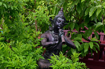 Obraz premium UTTARADIT, THAILAND - July 2, 2024: The Status of Phra Aphai Mani and Sunthorn Phu for display to decorate the garden with natural background at Thailand.