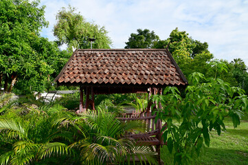 Part of the Roof of Thai style house in Thailand. Traditional Thai style pattern on the roof of a temple with Blue Sky Background.