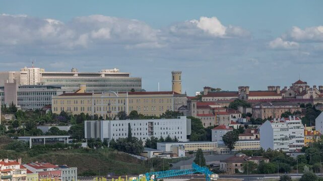 Aerial timelapse panorama of Lisbon city center with old prison (Estabelecimento Prisional de Lisboa), Colegio Almada Negreiros and Palacio da Justica. Located near Eduardo VII park. Portugal