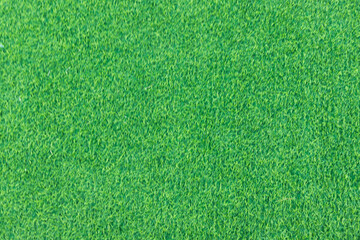 Close-up of lush green artificial grass, showcasing its detailed texture and vibrant color, perfect for outdoor landscaping and sports fields.