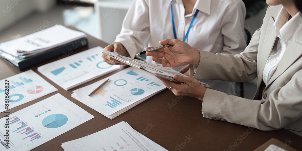 Poster business teamwork planning and analysis discussion with charts and graphs in a modern office setting